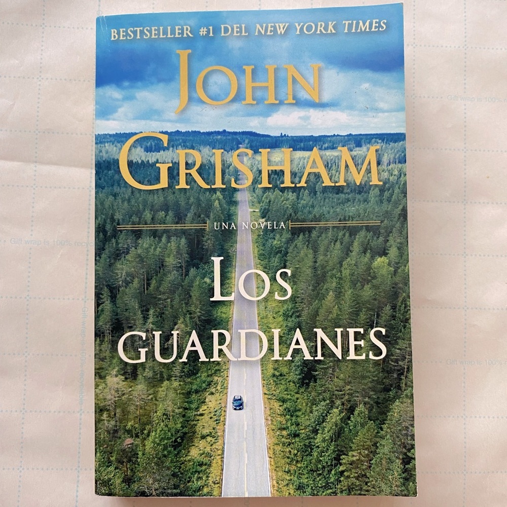 Spanish novel by John Grisham titled “ Los Guardianes” paperback cover